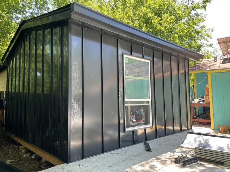 Black standing seam metal wall panels for Metal Roof Installation in Monona